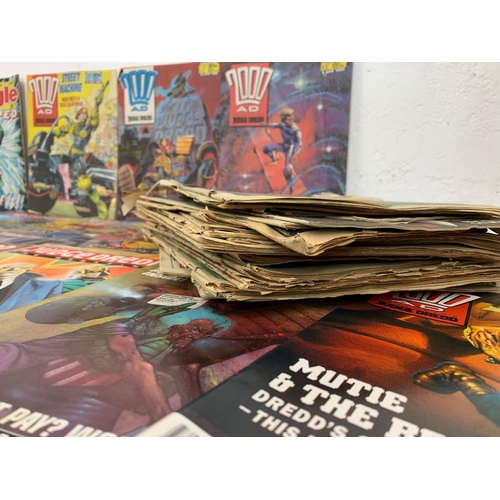 59 - A large collection of vintage comic books. 2000 AD Judge Dredd.