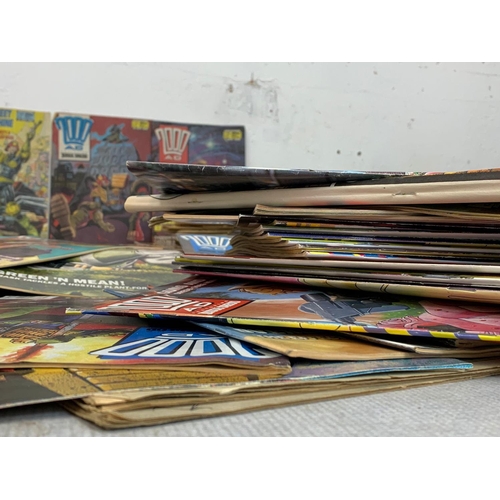 59 - A large collection of vintage comic books. 2000 AD Judge Dredd.