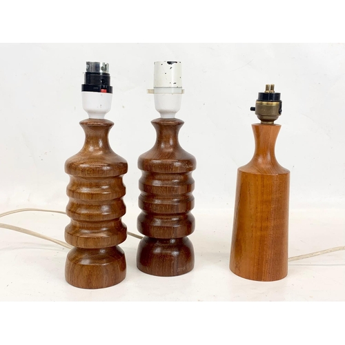 67 - A pair of Mid Century teak table lamps and other. 24cm