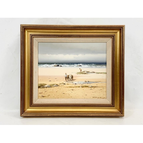 73 - An oil painting by Arthur H. Twells. Young Lads Gathering Kelp, Co Donegal. In a gilt frame. Paintin... 