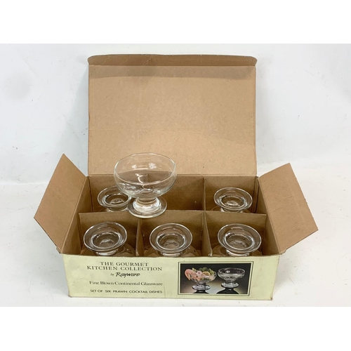 779 - 4 box sets of crystal glasses. Including a box of 4 Royal Doulton Hi-ball Tumblers, a 4 piece Desser... 