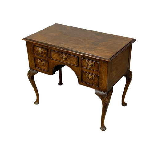 784 - A mid 19th century George I style burr walnut lowboy. 92 x 53 x 75cm