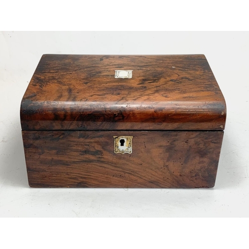 79 - A Victorian walnut writing box with key and mother of pearl inlay. Closed 30 x 22 x 15cm