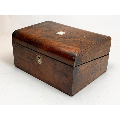 79 - A Victorian walnut writing box with key and mother of pearl inlay. Closed 30 x 22 x 15cm