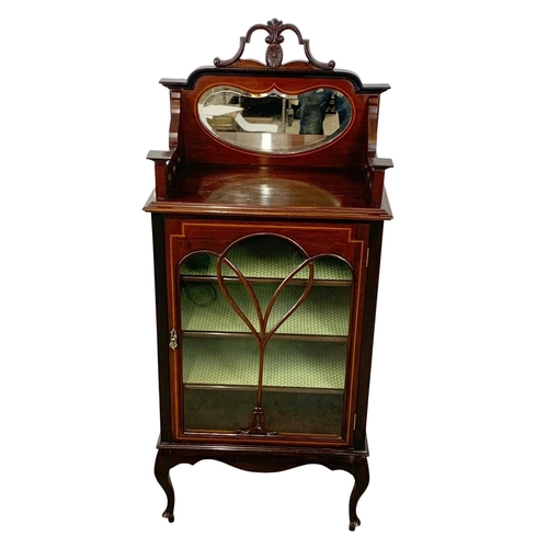 791 - An Edwardian inlaid mahogany mirror back music cabinet. 61 x 37 x 140cm