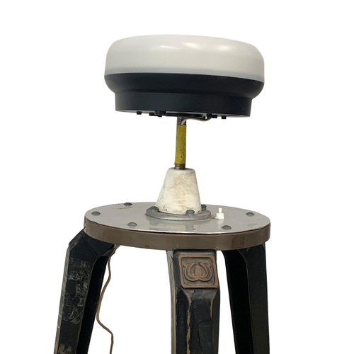 797 - A pair of early 20th century industrial cast iron stool bases converted into lamps. 93cm