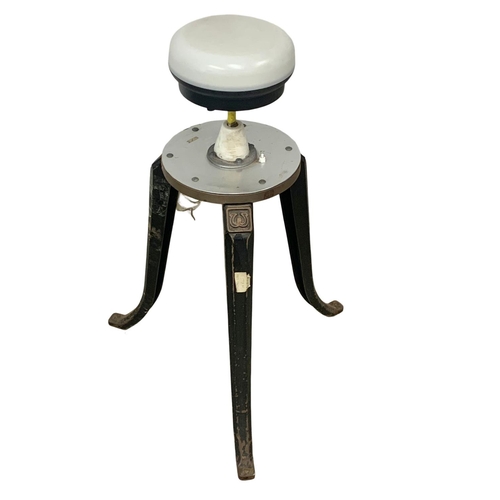 797 - A pair of early 20th century industrial cast iron stool bases converted into lamps. 93cm