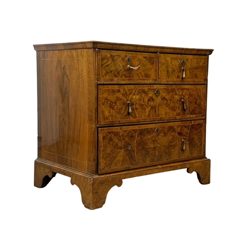 798 - An original early 18th century George I inlaid walnut chest of drawers, in bracket feet. Circa 1720.... 