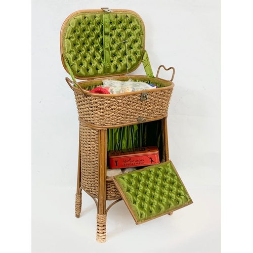 81 - A tall Edwardian wicker sewing basket. 43 x 67cm