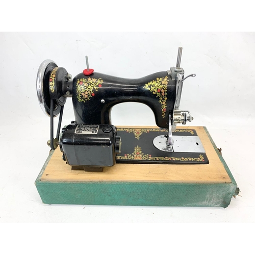 84 - A vintage Cinderella sewing machine. Number 207897. Case measures 41 x 21 x 32cm