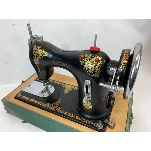 84 - A vintage Cinderella sewing machine. Number 207897. Case measures 41 x 21 x 32cm