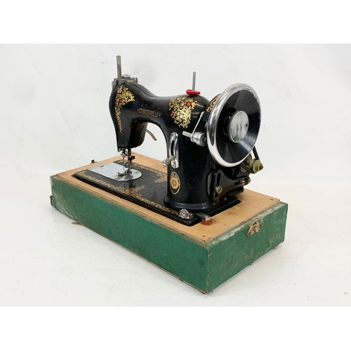 84 - A vintage Cinderella sewing machine. Number 207897. Case measures 41 x 21 x 32cm