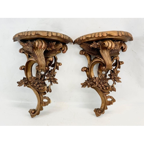 89 - A pair of 18th century style ornate gilt wall brackets. 33 x 44cm