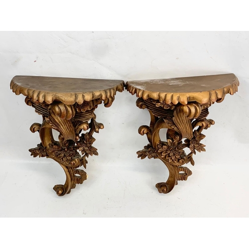 89 - A pair of 18th century style ornate gilt wall brackets. 33 x 44cm