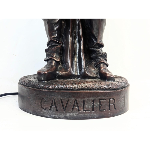 95 - A large resin bronze effect Cavalier lamp. 106cm