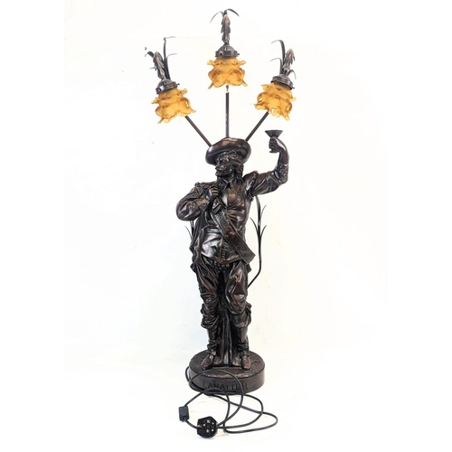 95 - A large resin bronze effect Cavalier lamp. 106cm