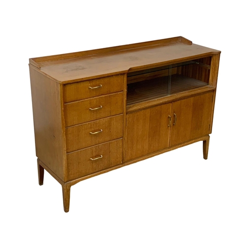 1133 - A vintage oak sideboard by Lebus. 131 x 44 x 93.5cm