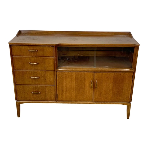 1133 - A vintage oak sideboard by Lebus. 131 x 44 x 93.5cm