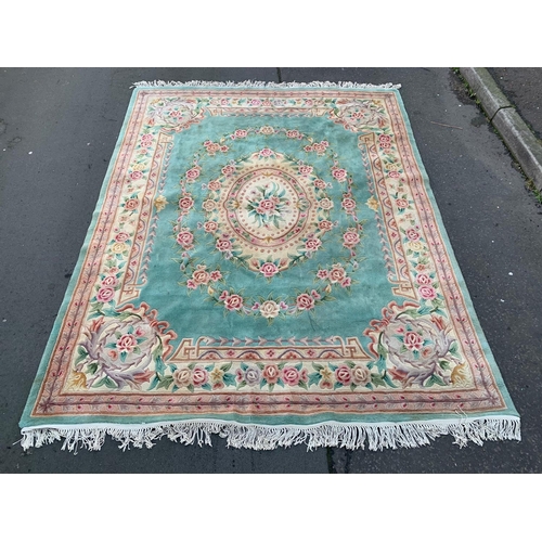 1137 - A large wool rug. 275 x 320cm