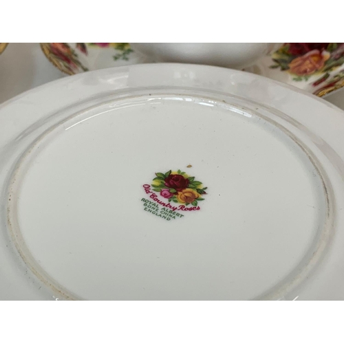 442 - A 25 piece Royal Albert Old Country Roses tea set. Including a cake stand, cake plate, salt and pepp... 