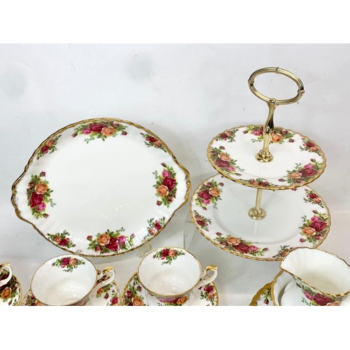 442 - A 25 piece Royal Albert Old Country Roses tea set. Including a cake stand, cake plate, salt and pepp... 