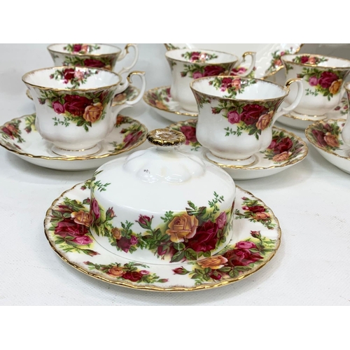 442 - A 25 piece Royal Albert Old Country Roses tea set. Including a cake stand, cake plate, salt and pepp... 