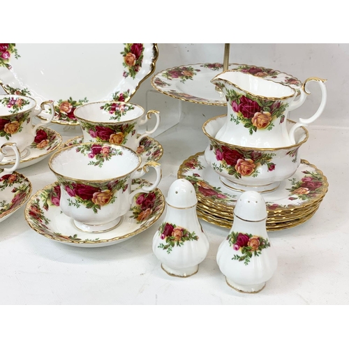 442 - A 25 piece Royal Albert Old Country Roses tea set. Including a cake stand, cake plate, salt and pepp... 