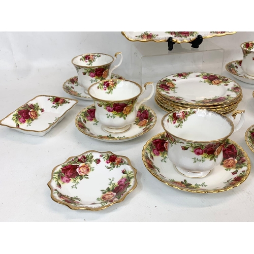 443 - A 23 piece Royal Albert Old Country Roses tea set. 6 cups, 6 saucers, 6 sandwich plates, cake dish e... 