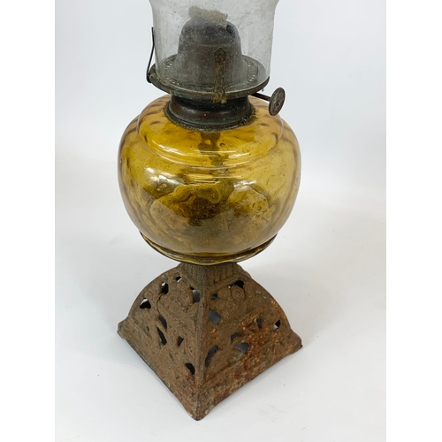 89 - A Victorian amber glass oil lamp. 47.5cm