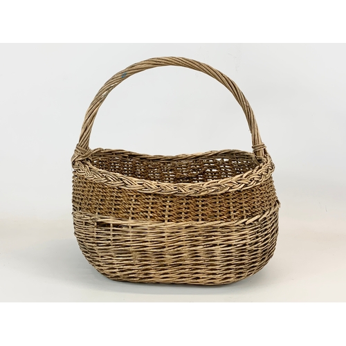 92 - An Edwardian wicker basket. 33 x 34cm.