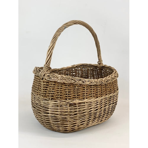 92 - An Edwardian wicker basket. 33 x 34cm.