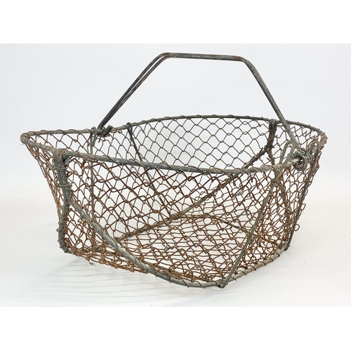 94 - 2 Edwardian period wire baskets. Largest 51 x 34 x 28cm.