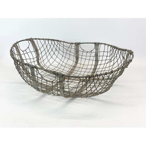 95 - 3 large early 20th century wire baskets.