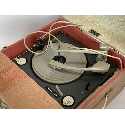 101 - A vintage Dansette Conquest record player. 41 x 49 x 25cm