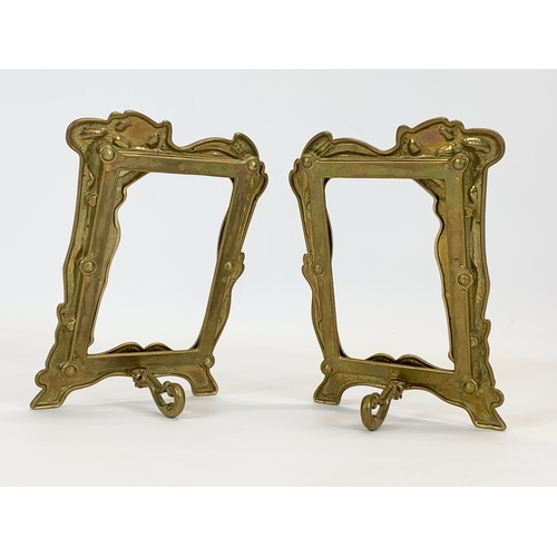 450 - A pair of Art Nouveau style brass photo frames. 15 x 21cm.