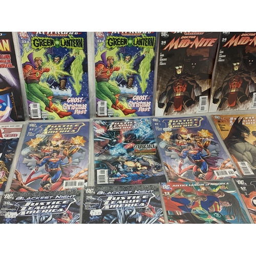 134 - A collection of Marvel and DC comic books.