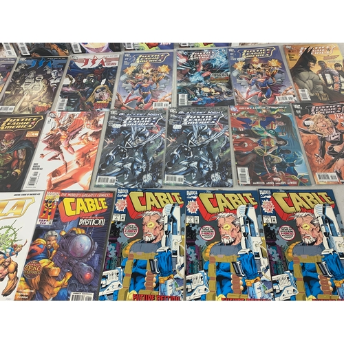 134 - A collection of Marvel and DC comic books.