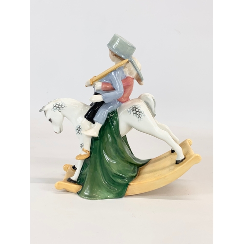 452 - A large Royal Doulton “Hold Tight” pottery figurine. 21 x 21cm.