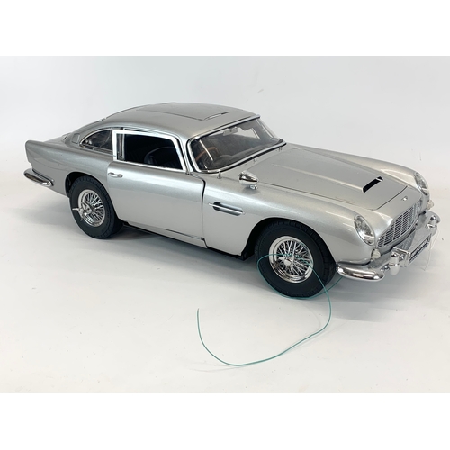 136 - A large James Bond 007 Goldfinger Aston Martin DB5 by Superleggera, with paperwork etc. Car measures... 