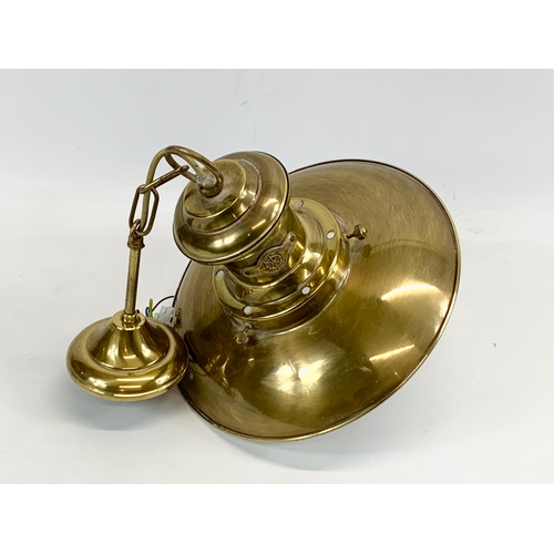 119 - A brass ceiling light. 30 x 55cm including chain.