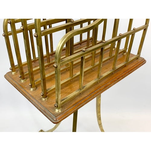 122 - A late Victorian brass and oak magazine/ music stand. Circa 1890. 48 x 46 x 95cm