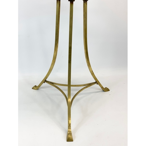 122 - A late Victorian brass and oak magazine/ music stand. Circa 1890. 48 x 46 x 95cm