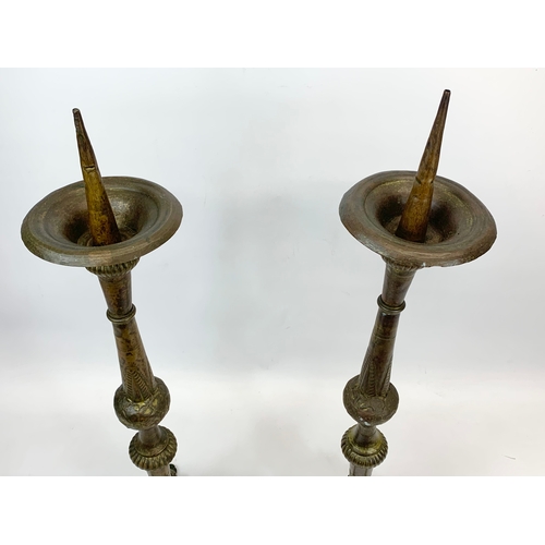 123 - A pair of large late 19th century brass Church candlesticks.