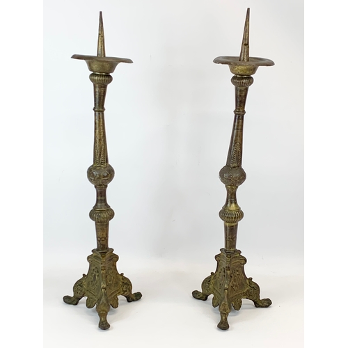 123 - A pair of large late 19th century brass Church candlesticks.