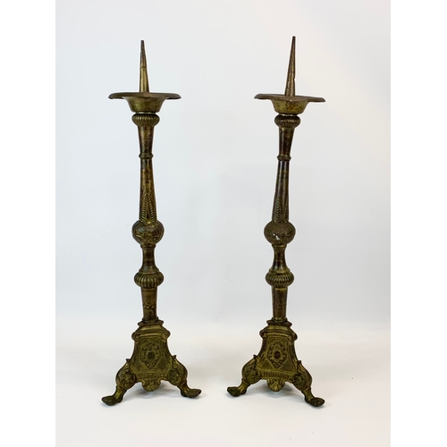 123 - A pair of large late 19th century brass Church candlesticks.