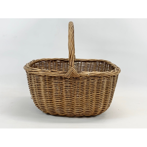 125 - A vintage wicker basket. 39 x 32 x 38cm