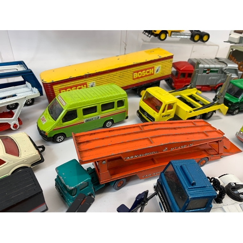 152 - A collection of model cars and trucks etc. Dinky, Corgi, Matchbox, Lesney and French makes.