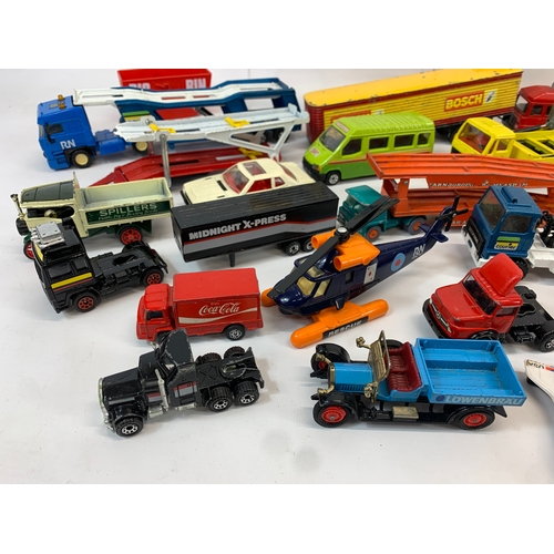 152 - A collection of model cars and trucks etc. Dinky, Corgi, Matchbox, Lesney and French makes.