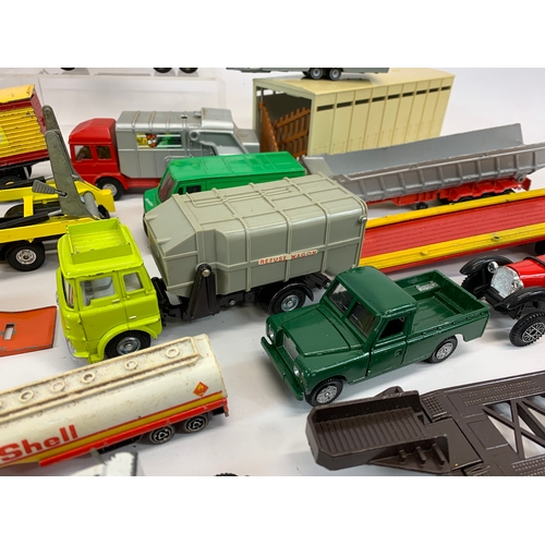 152 - A collection of model cars and trucks etc. Dinky, Corgi, Matchbox, Lesney and French makes.