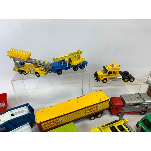 152 - A collection of model cars and trucks etc. Dinky, Corgi, Matchbox, Lesney and French makes.